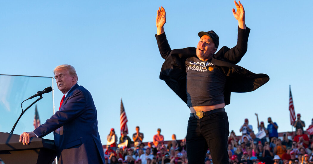 elon musk celebrating on stage
