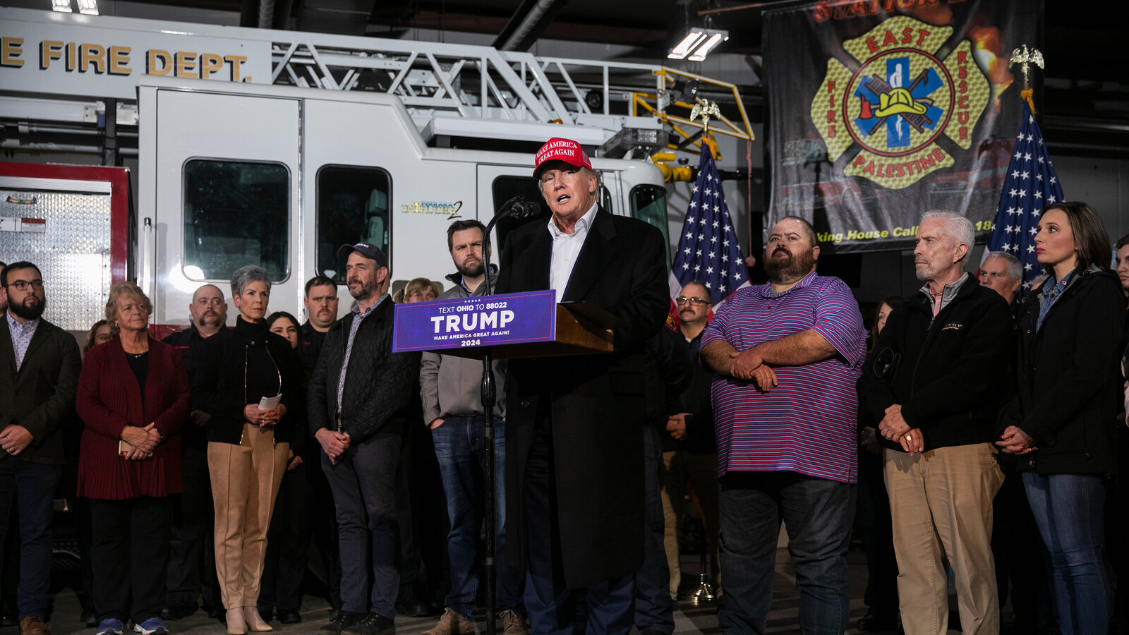 president trump visiting disaster site with first responders and local officials