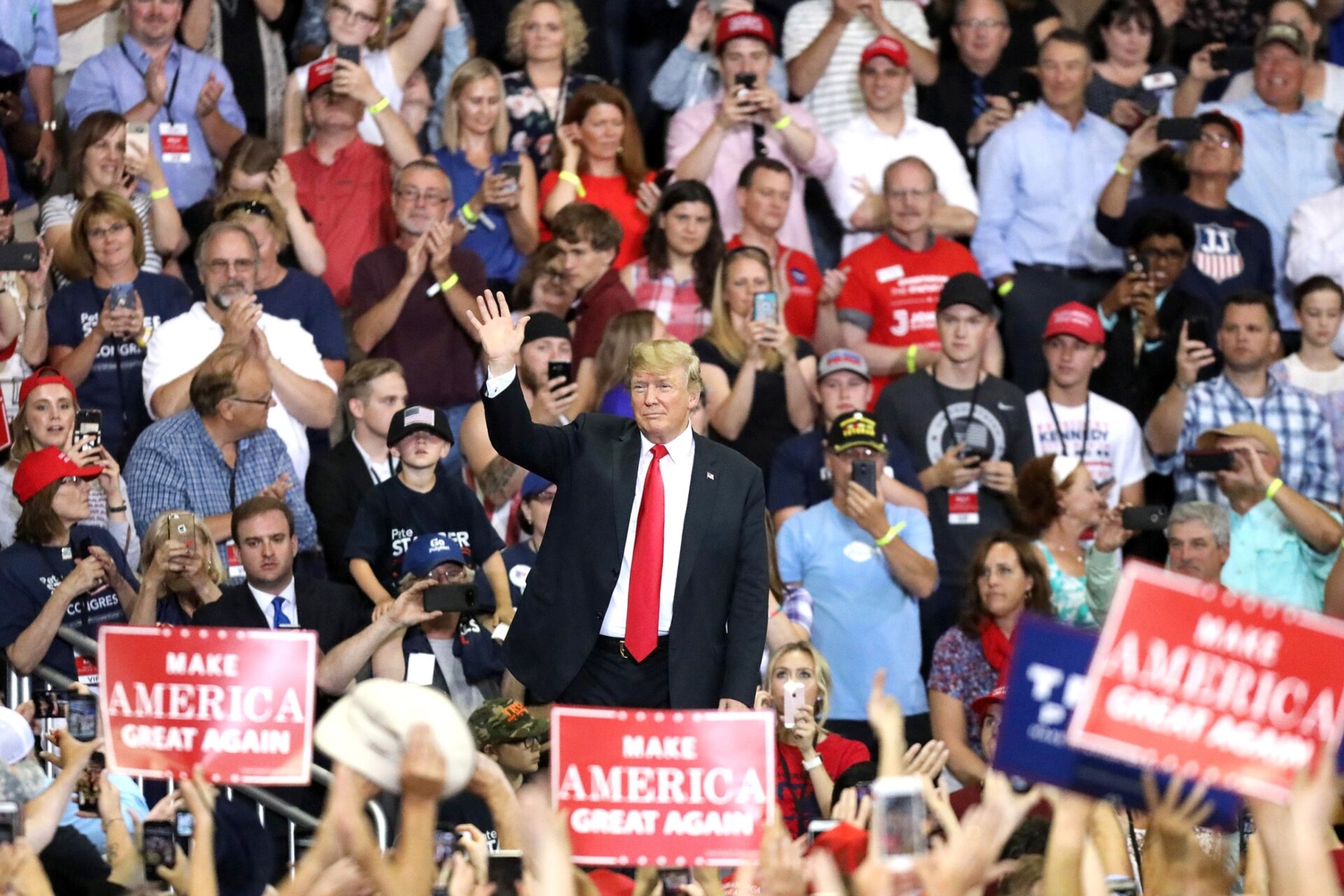 trump pointing to cheering crowd