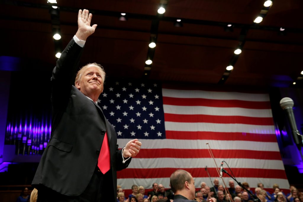 trump celebrating on stage