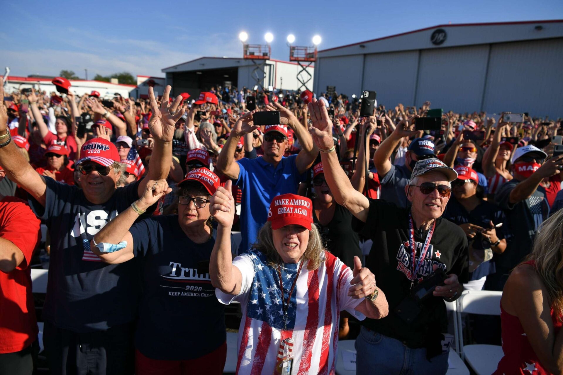group of senior citizens cheering at trump rally
