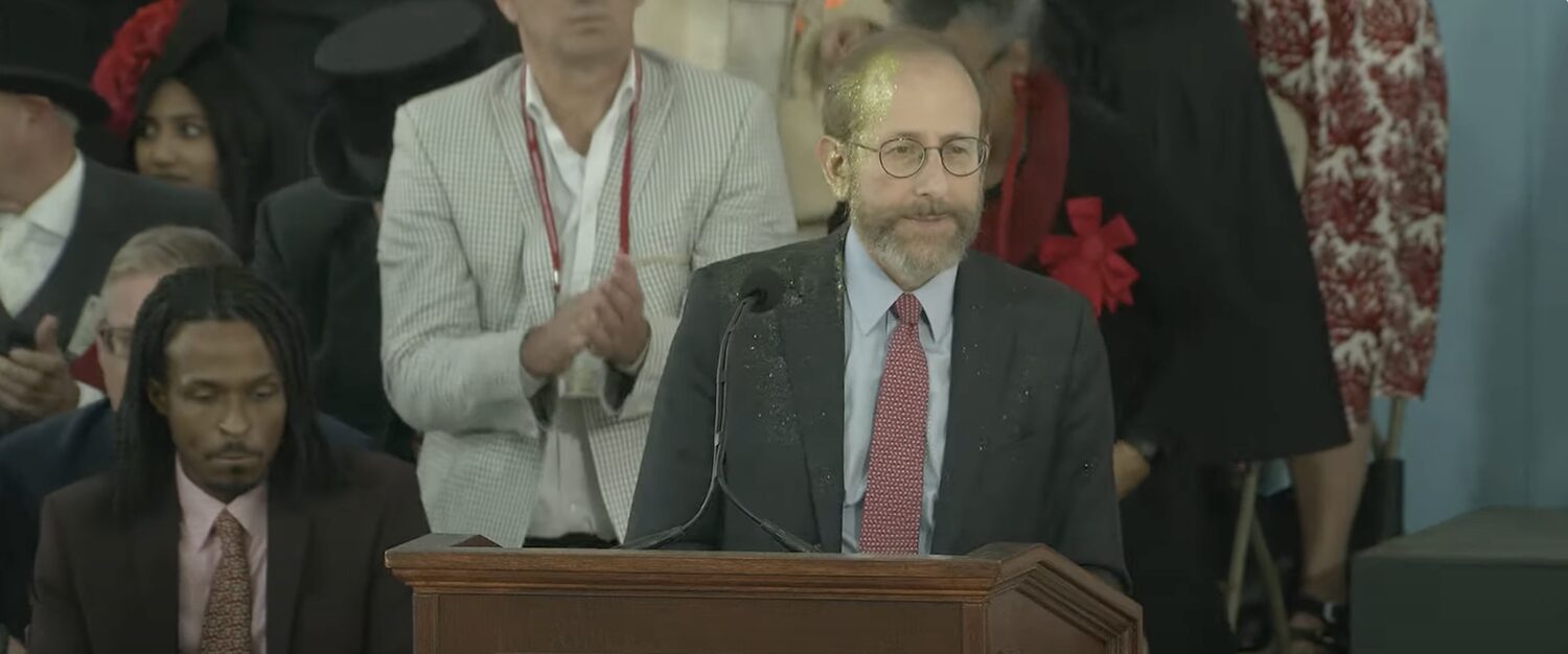 alan garber speaking on stage at harvard event