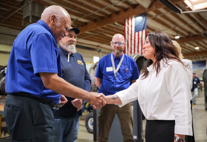 american workersshaking hands