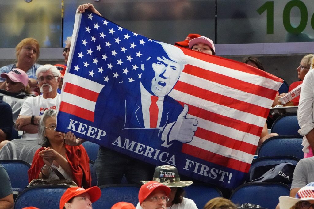 america first flag at a pro trump rally