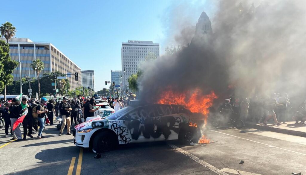 burning police car los angeles riot 2025