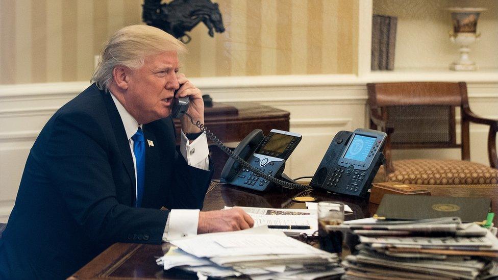 Donald Trump on the phone in Oval Office