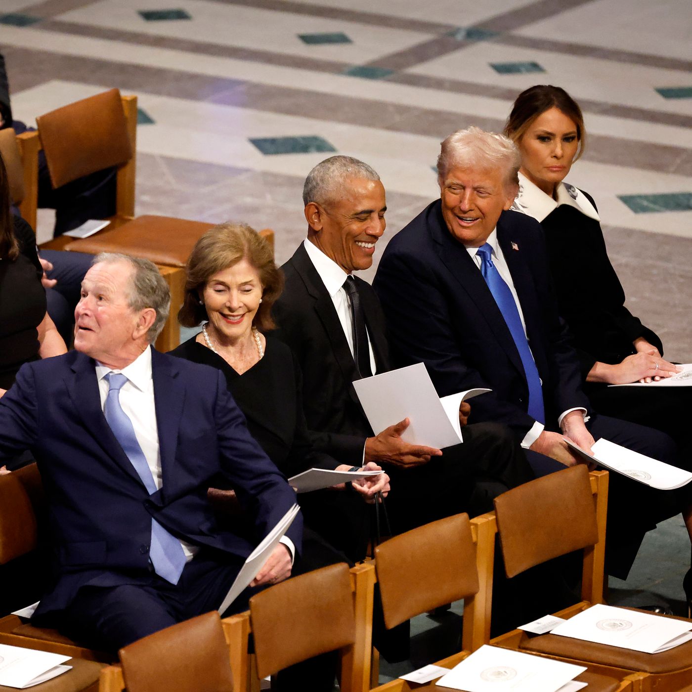 Social media reactions to Trump and Obama chatting during Carter's funeral