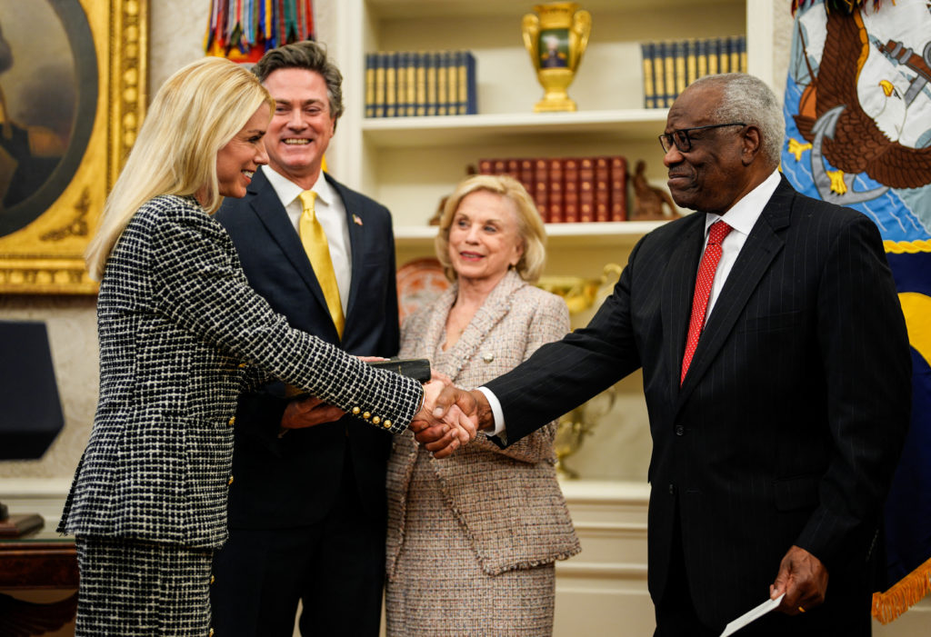 trump and bondi shaking hands