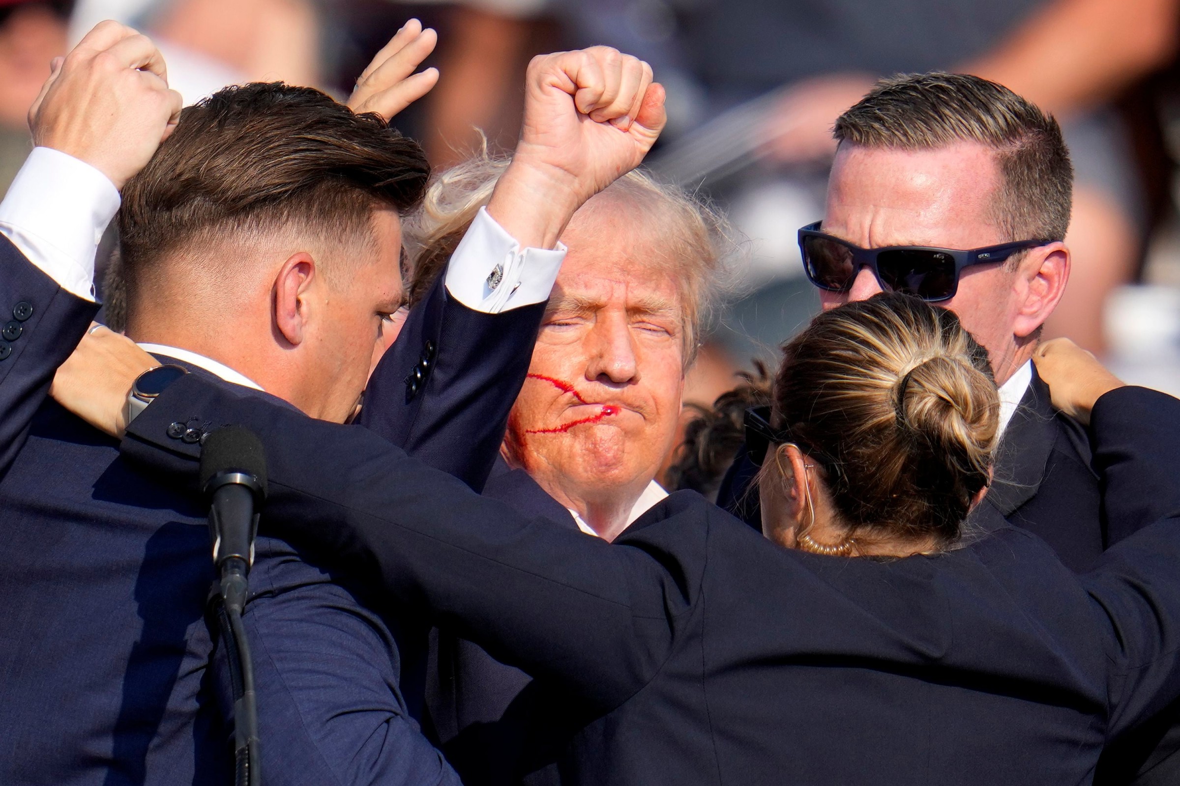 Secret Service agents shielding a bleeding President Trump during the Butler, Pennsylvania rally, July 2024