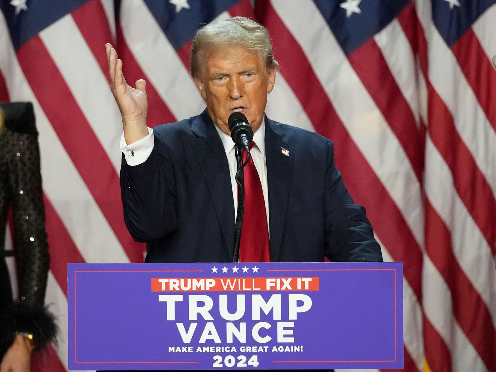 President Trump on stage, looking forward with a determined expression