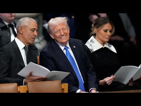 President Trump gesturing while speaking, Obama listening and smiling during Carter's funeral