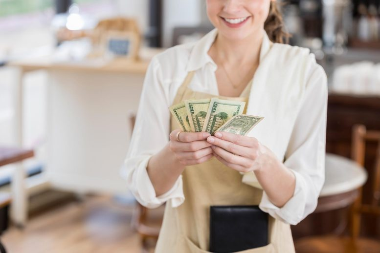 happy waitress gets to keep all of her tip money