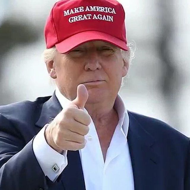 President Trump  MAGA hat on, thumbs up