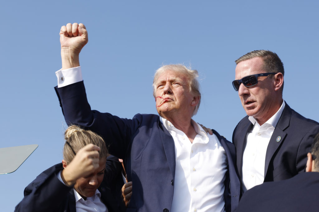 donald trump raises fist after butler assassination attempt