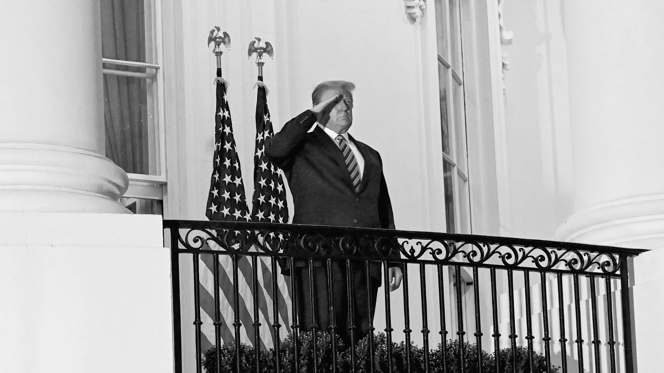 donald trump standing on white house balcony black and white photograph