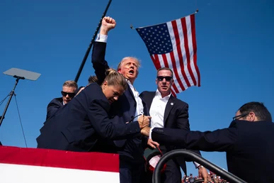 donald trump at rally with fist in the air