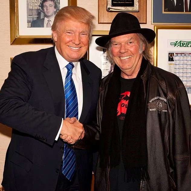 trump and young shaking hands