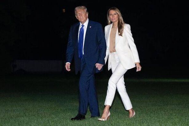 President Trump and first lady melania trump walk on south lawn after returning from un speech