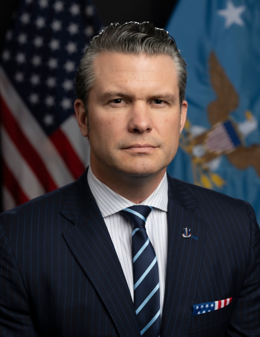 Secretary Pete Hegseth in a serious, determined pose
