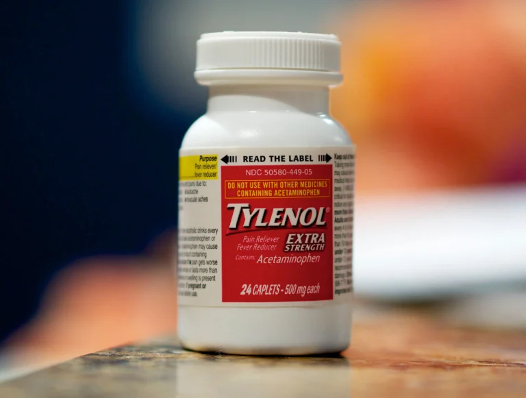 A bottle of Tylenol or similar common pain reliever, with a subtle overlay suggesting caution or a warning symbol