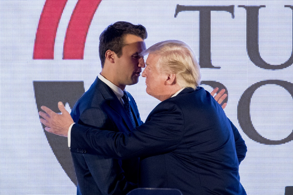 trump and kirk embracing on stage