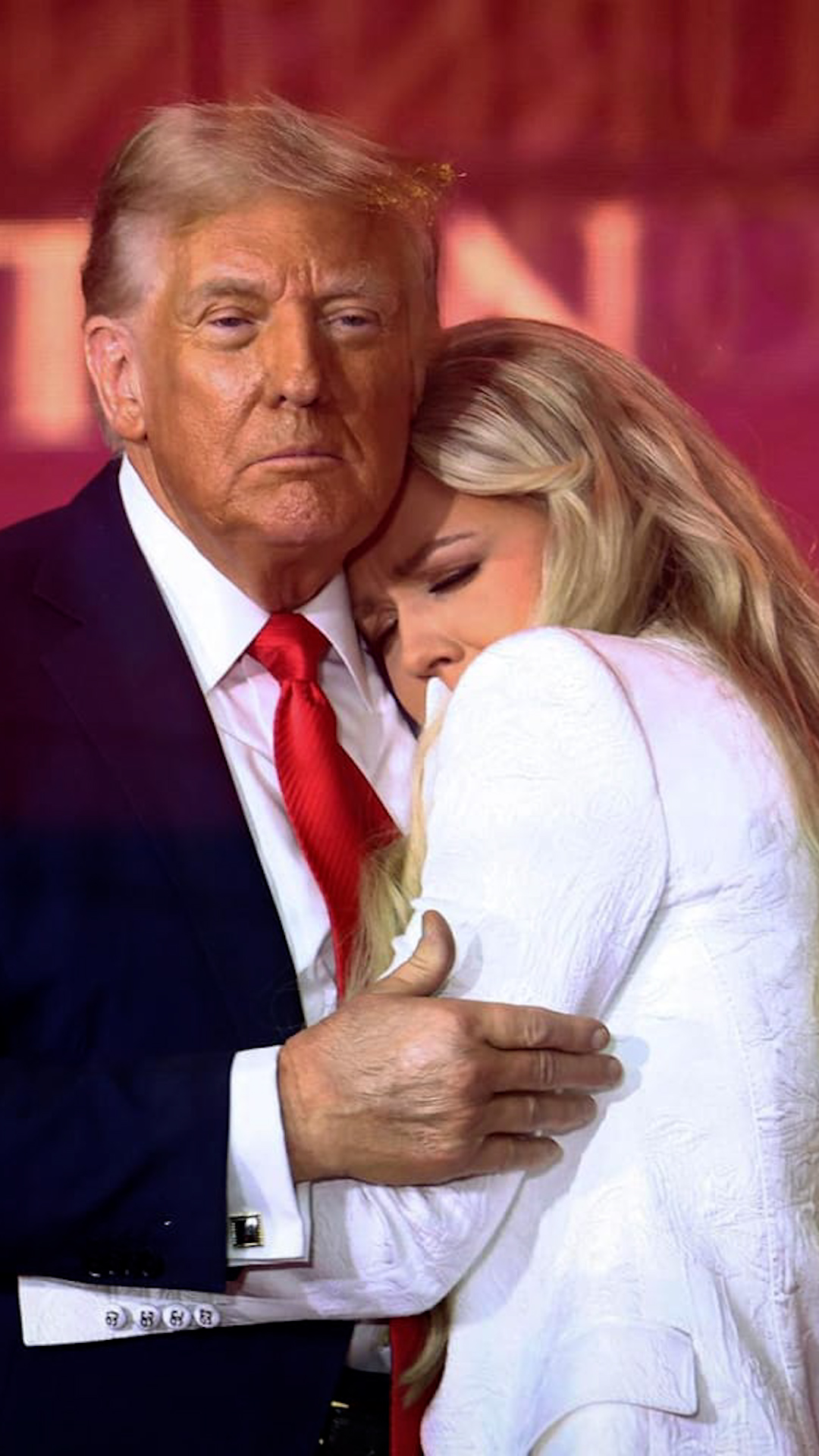 Erika Kirk and donald trump hugging at charlie kirks memorial