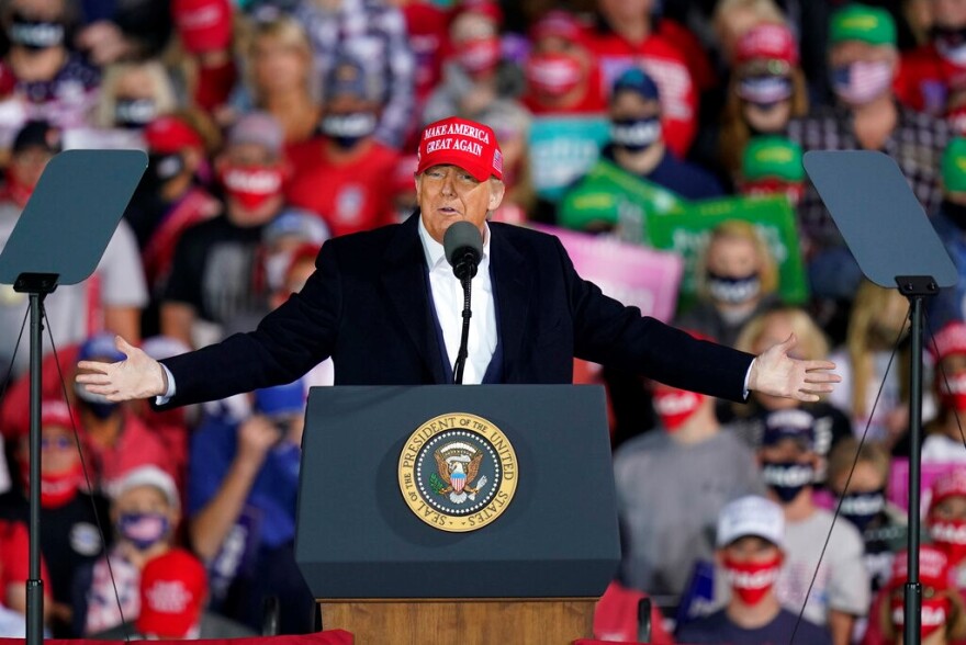 donald trump speaking to supporters at a rally