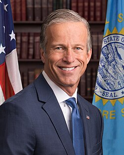 Senate Majority Leader John Thune walking in the Capitol