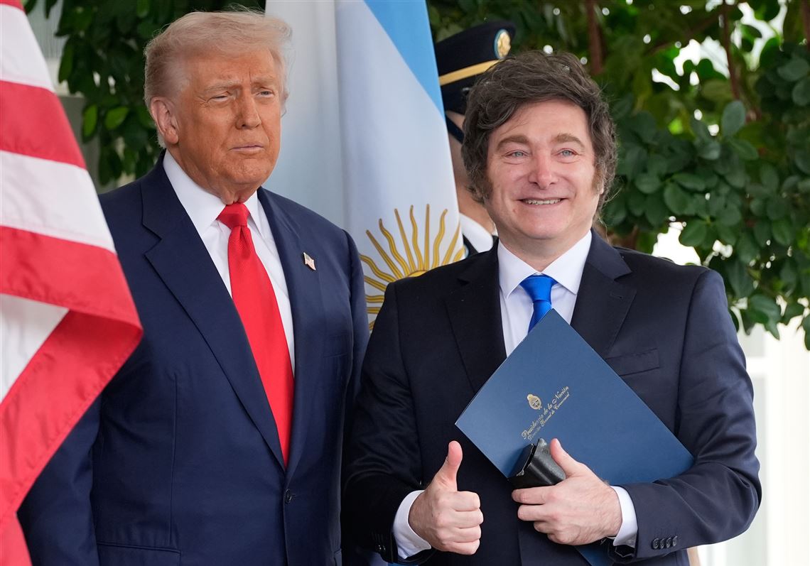 Donald Trump and Javier Milei shaking hands at the White House October 2025.