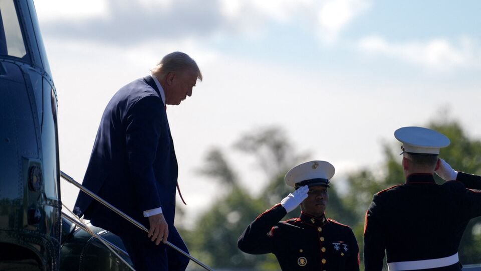 Donald Trump meeting with uniformed military personnel at Walter Reed Medical Center, shaking hands and smiling. October 2025.