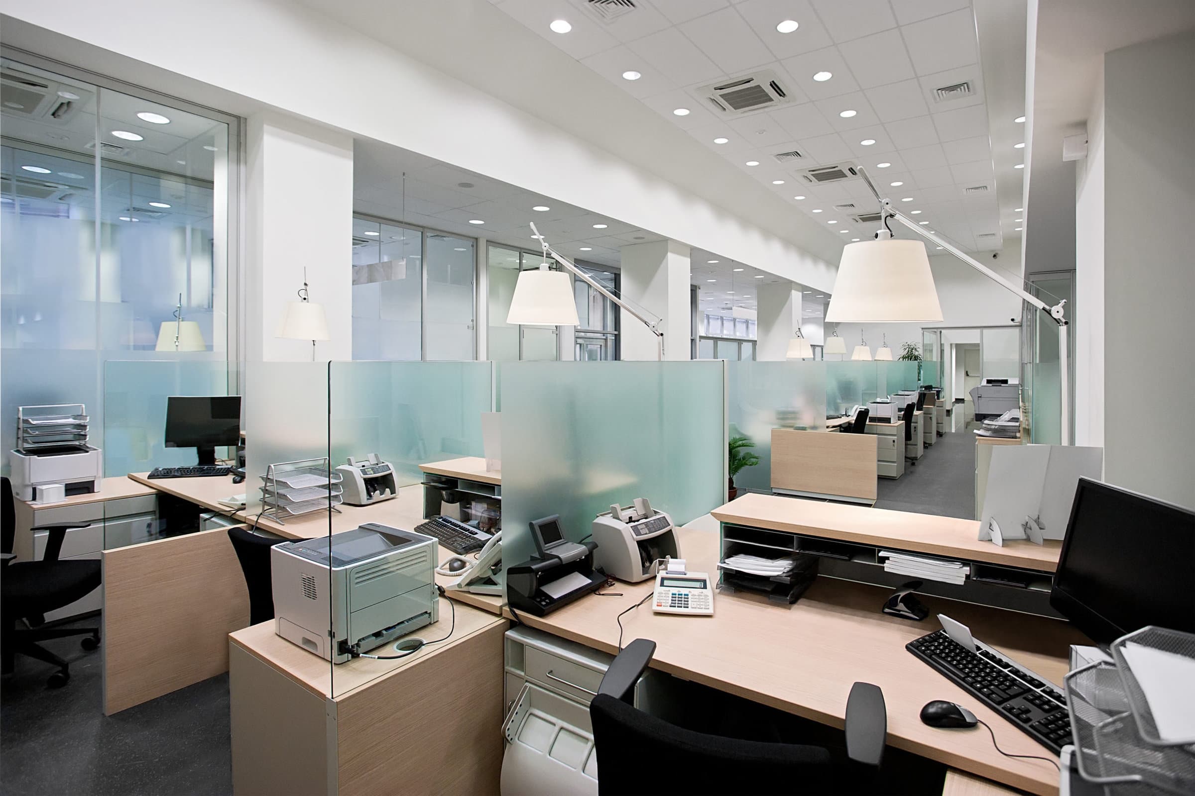A symbolic image of a government building or office, with a sense of empty desks or a reduced workforce,