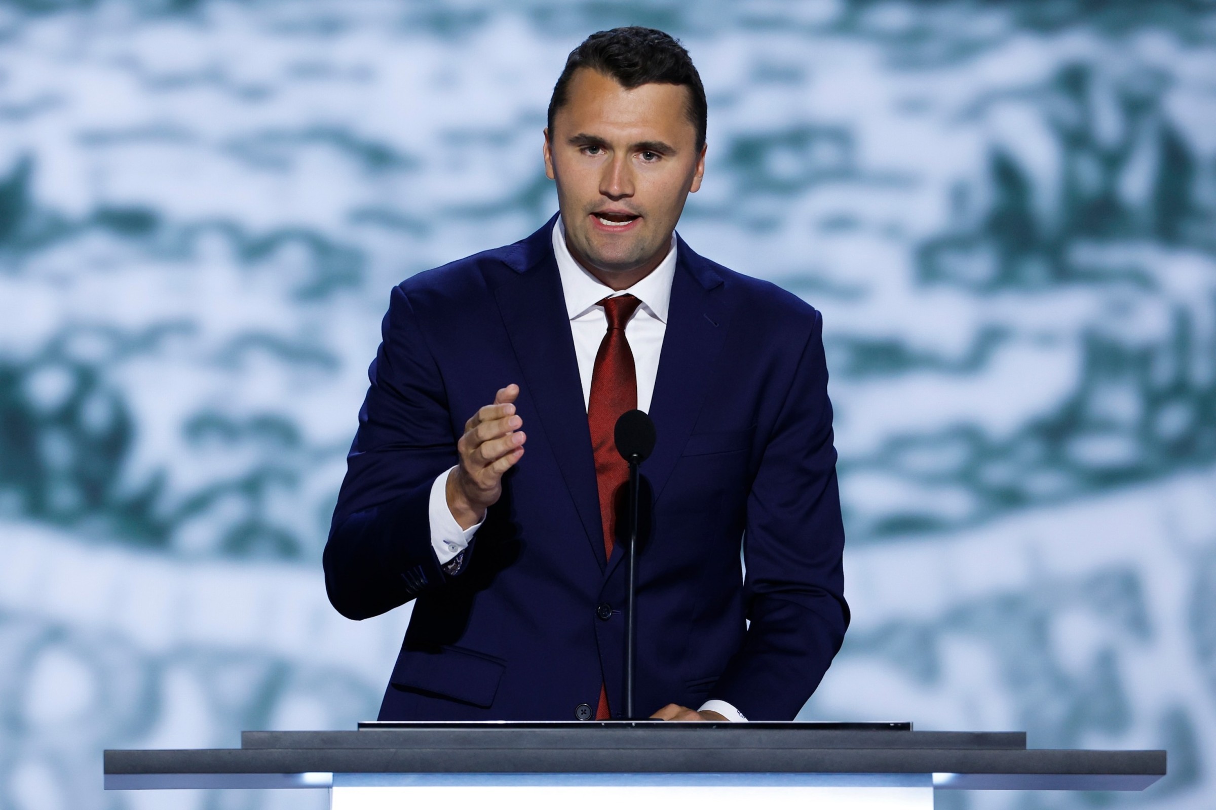 Charlie Kirk speaking passionately at a Turning Point USA event